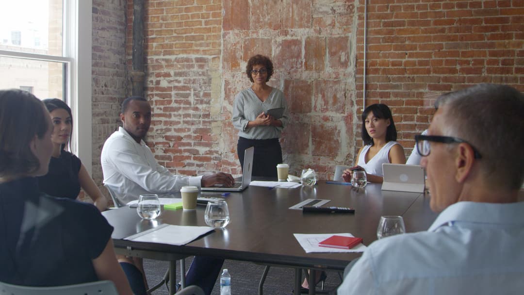 Group of businesspeople meeting in boardroom